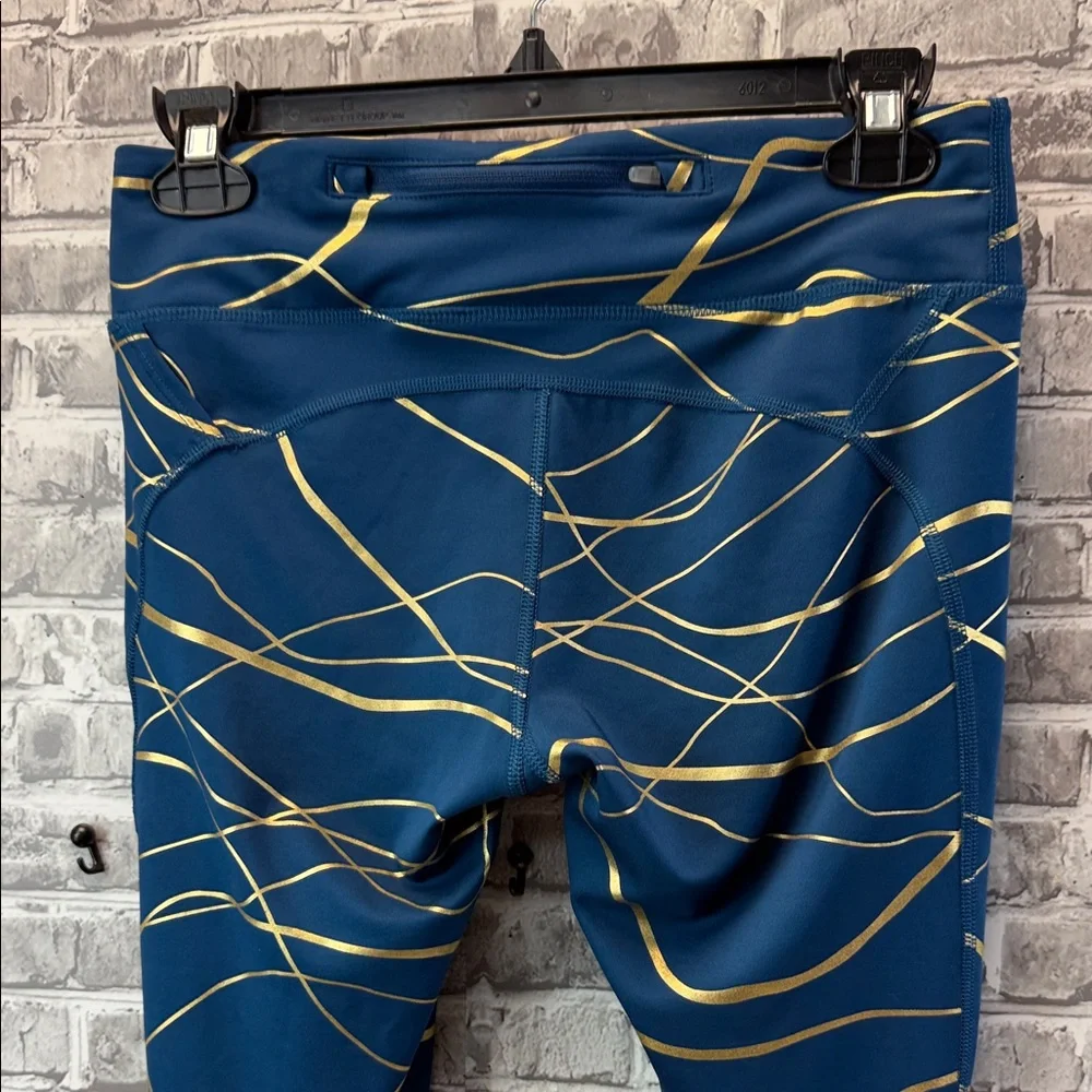 Nike running leggings with Blue and Gold Design‎